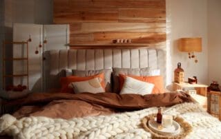 Cozy,Bedroom,Interior,With,Knitted,Blanket,And,Cushions